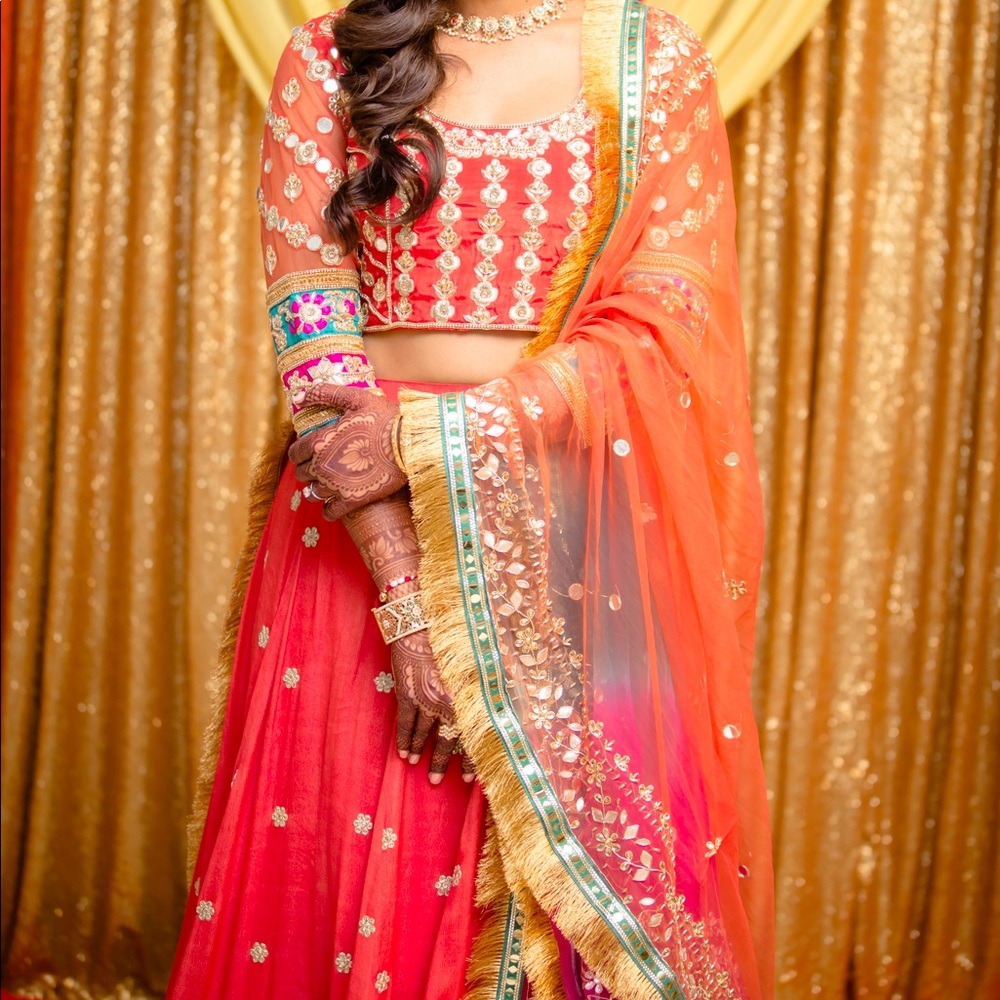 Rust colored lehenga with multicolor dupatta